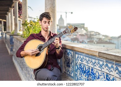 Fado Musician Playing On Portuguese Guitar In Lisbon, Portugal 