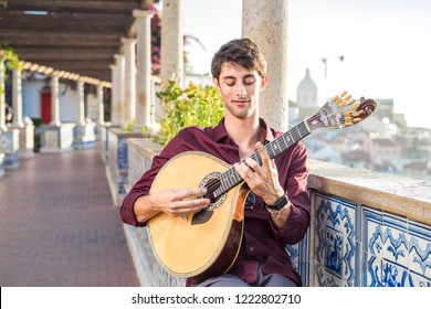 Fado Musician Playing On Portuguese Guitar In Lisbon, Portugal 