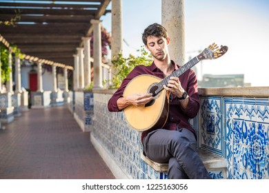 Fado Musician Playing On Portuguese Guitar In Lisbon, Portugal 