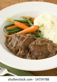 Faggots in Onion Gravy with Mashed Potato and Vegetables