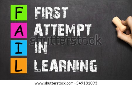 FAIL acronym First Attempt In Learning handwritten with white chalk on blackboard.