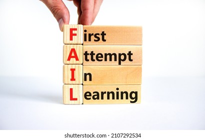 FAIL first attempt in learning symbol. Wooden blocks with words FAIL first attempt in learning. Beautiful white table, white background, copy space. Business, FAIL first attempt in learning concept.