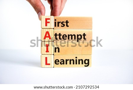 FAIL first attempt in learning symbol. Wooden blocks with words FAIL first attempt in learning. Beautiful white table, white background, copy space. Business, FAIL first attempt in learning concept.