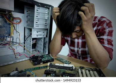 Fail Tired And Bored Computer Repairman Is Sitting On His Workplace And Thinking.