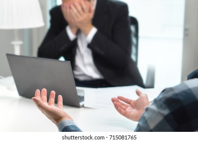 Failed Job Interview Or Business People Having Fight In Office. Businessman Covering And Holding Face With Hands In Meeting. Boss Do Not Want To Fire Employee. Bad Management Or Working Environment