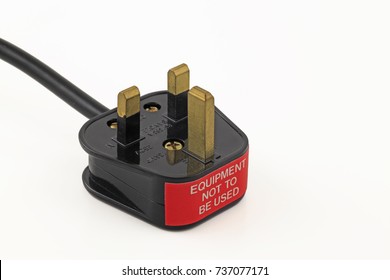Failed pat test – An isolated uk plug with a failed sticker on a white background