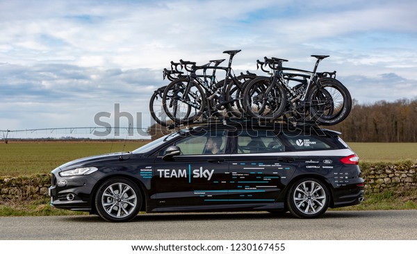 Fains-la-Folie, France - March 5, 2018:\
The technical car of  Team Sky driving on a country road after the\
passing of the peloton during the stage 2 of Paris-Nice\
2018.