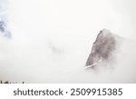 Faint Details Of Mount Raininer Through Fog With Echo Rock On The Right