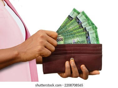 Fair Female Hand Holding Brown Purse With Guyanese Dollar Notes, Hand Removing Money Out Of Purse Isolated On White Background