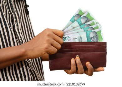 Fair Female Hand Holding Brown Purse With Colombian Peso Notes, Hand Removing Money Out Of Purse Isolated On White Background