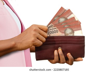 Fair Female Hand Holding Brown Purse With Chilean Peso Notes, Hand Removing Money Out Of Purse Isolated On White Background