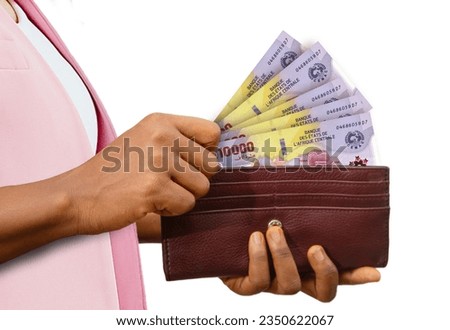 fair Female Hand Holding brown Purse With Central African CFA franc notes, hand removing money out of purse isolated on white background