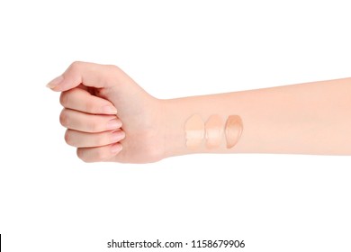 Fair, Medium, Dark Swatches  Of Foundation On The Hand Isolated On White.