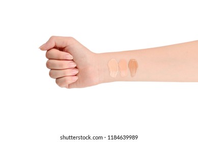 Fair, Medium, Dark Swatches  Of Foundation On The Hand Isolated On White.