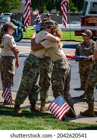 FAIR OAKS, CA, U.S.A. - SEPT. 16, 2021: Two Women With Hamid Karzai International Airport  (HKIA) Military Treatment Facility (MTF) Uniforms Hug After The Arrival Of Sgt. Nicole Gee's Funeral Hearse.