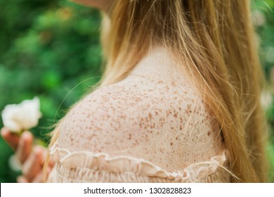 Fair Skin Freckled Ginger Girl Holding Delicate White Flower, Shallow Depth Of Field Cute Body Freckles On Shoulder