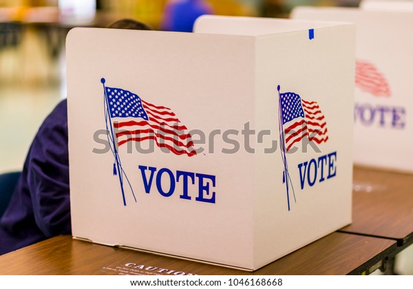 FAIRFAX COUNTY, VIRGINIA, USA -\
NOVEMBER 4, 2008: Voting at polls during presidential\
election.