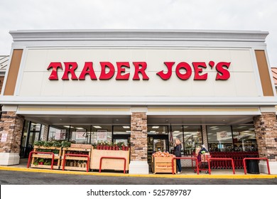 Fairfax, USA - November 25, 2016: Trader Joes Grocery Store Facade With Sign And Items On Display And People Walking