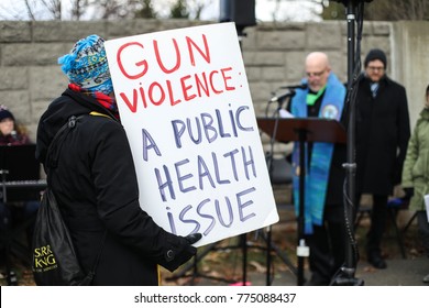 Fairfax, VA - December 14, 2017: Protesters Gather For A Vigil Outside Of The NRA On The Fifth Anniversary Of The Sandy Hook Elementary School Shooting In Newtown, Connecticut In 2012.