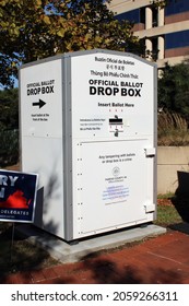 Fairfax, Virginia, United States - September 26, 2021: A ballot drop box in front of the Fairfax County Government Center in Virginia displays text instructing voters where to insert their ballot.