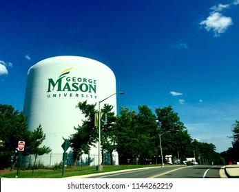 Fairfax, Virginia, USA - July 28, 2018: A Large Water Tower With The George Mason University Logo Stands Out Against A Blue Sky On A Sunny Afternoon On The University's Fairfax Campus.