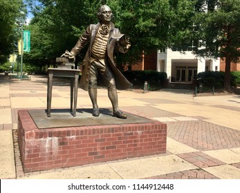 Fairfax, Virginia, USA - July 28, 2018: A Bronze Statue Honoring George Mason Is A Well-known Landmark To Students And Faculty On The Main Campus Of George Mason University.