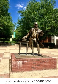 Fairfax, Virginia, USA - July 28, 2018: A Bronze Statue Honoring George Mason Is A Well-known Landmark To Students And Faculty On The Main Campus Of George Mason University.