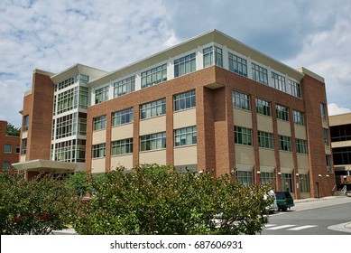 Fairfax, Virginia, USA - July 4, 2017: An Academic Building Stands Out Against A Cloudy Sky On The Main Campus Of George Mason University.