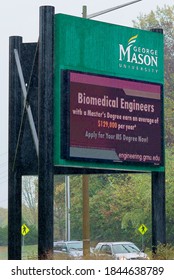 Fairfax, Virginia / USA - October 29, 2020: An Electronic Marquee At An Entrance To George Mason University’s Main Campus Advertises A “Biomedical Engineers” Graduate Program On A Rainy Day.