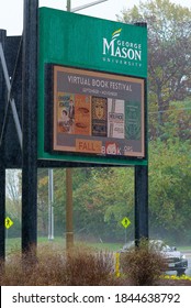 Fairfax, Virginia / USA - October 29, 2020: An Electronic Marquee At An Entrance To George Mason University’s Main Campus Advertises A “Virtual Book Festival” On A Rainy Day.