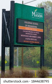 Fairfax, Virginia / USA - October 29, 2020: An Electronic Marquee At An Entrance To George Mason University’s Main Campus Advertises The Volgenau School Of Engineering On A Rainy Day.