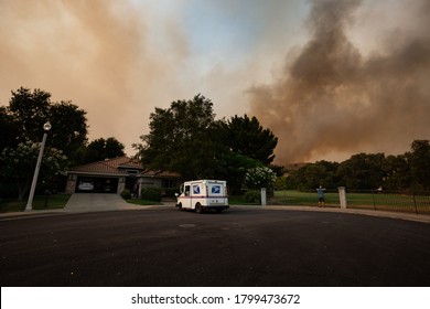 Fairfield, California / USA - August 19 2020: A USPS Mail Carrier Delivers Mail During The LNU Lightning Complex Fires.