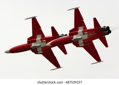 FAIRFORD, UNITED KINGDOM - JULY 16, 2017: Northrop F-5 of Patrouille Suisse aerobatics team performing demonstration flight at Royal International Air Tattoo show at Fairford AFB