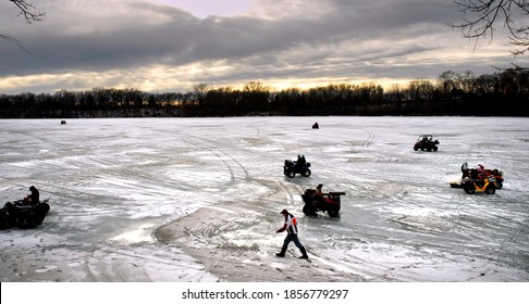 FAIRMONT, MN, USA, Ice Fishing Anglers Use ATVs To Travel On A Frozen Minnesota Lake During Winter Ice Fishing Tournament. 1-2016