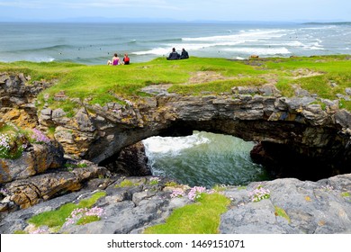 Fairy bridges, impressive stone arches near Tullan Strand, one of Donegal's surf beaches, framed by a scenic back drop provided by the Sligo-Leitrim Mountains, County Donegal, Ireland.