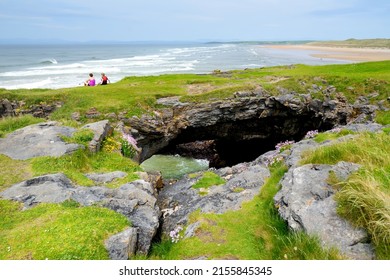 Fairy bridges, impressive stone arches near Tullan Strand, one of Donegals surf beaches, framed by a scenic back drop provided by the Sligo-Leitrim Mountains, County Donegal, Ireland