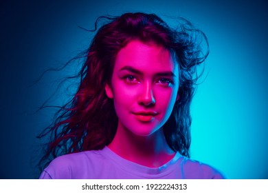 Fairy. Caucasian Woman's Portrait Isolated On Blue Studio Background In Multicolored Neon Light. Beautiful Female Model. Concept Of Human Emotions, Facial Expression, Sales, Ad, Fashion. Copyspace.