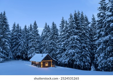 Fairy Christmas landscape with glowing wooden cabin in snowy forest. Cozy house in winter mountains - Powered by Shutterstock