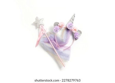 Fairy costume, unicorn on a white background. Top view, flay lay. - Powered by Shutterstock