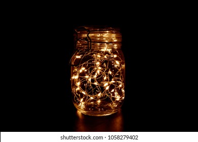 Fairy Light in a Glass Jar, in the Dark, Low-Key Photography - Powered by Shutterstock