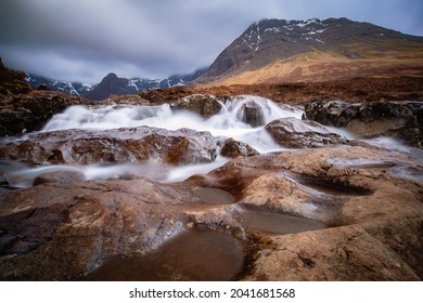The Fairy Pools and waterfalls on an overcast day near Glenbrittle at the Isle of Skye, Scotland. They bring cristal clear water from up the Cuillin mountains.