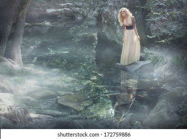  Fairy tale.woman in mystery garden looking in pool.