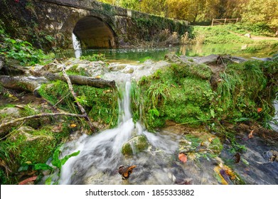 Fairytale by the river beautiful cascades and an old bridge in Orbaneja del Castillo, Burgos, Spain. High quality photo