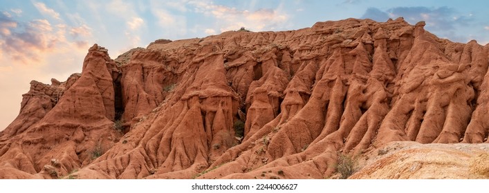 Fairytale Canyon is a unique rock formation located in Kyrgyzstan. The canyon is known for its unusual and colorful rock formations, which have been shaped over time by wind and water erosion.