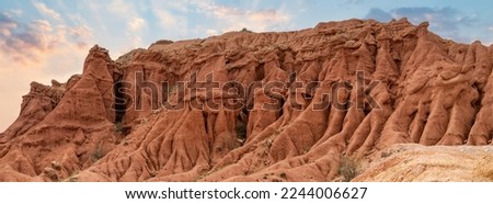Fairytale Canyon is a unique rock formation located in Kyrgyzstan. The canyon is known for its unusual and colorful rock formations, which have been shaped over time by wind and water erosion.