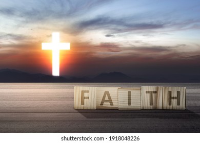 Faith Text On Wooden Table With Christian Cross On The Sky