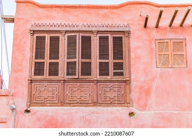 Faiyum, Egypt. Shuttered Window On A Pink Stucco Building In Faiyum.