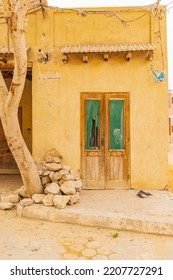 Faiyum, Egypt. Wooden Door In A Stucco Building In Faiyum.