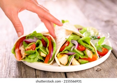 Fajita With Chicken And Vegetable And Woman's Hand