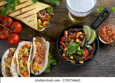 Fajitas, Burritos, Tacos With Salsa And A Glass Of Beer